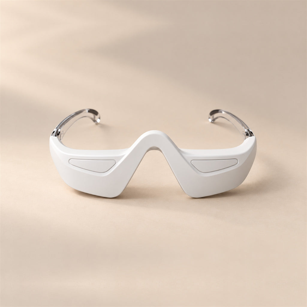 bewhile halo from the front on a sand background: a white under-eye band with a nose bridge and clear temple arms (mockup)